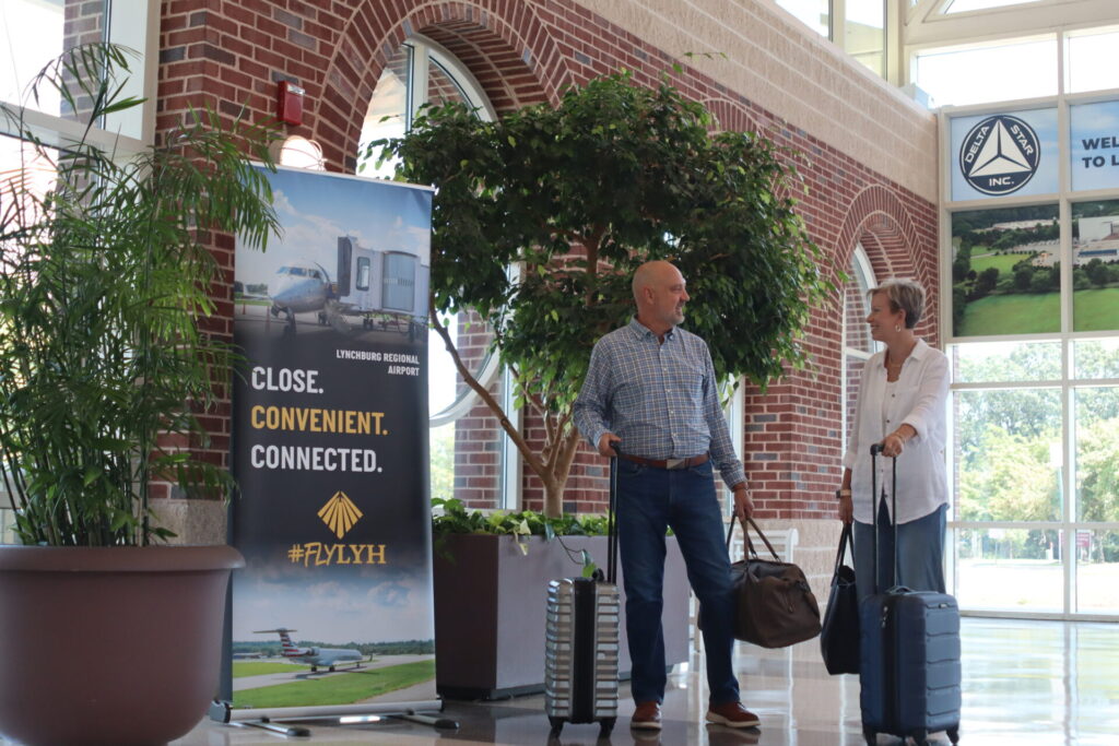 A couple with luggage at the Lynchburg Regional Airport